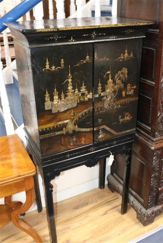 A Victorian japanned and mother-of-pearl inlaid papier mache collectors cabinet on stand, W.72cm